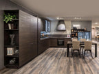 The Urban Kitchens by ORDER Kitchen Furniture features dark wood cabinets, built-in appliances, custom furniture, a dining table with four beige chairs, open shelves, and light wood floors in a contemporary minimalist design.