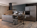 Modern kitchen by ORDER Kitchen Furniture: gray cabinets, island with two bar stools, built-in oven, fridge, range hood, and wood floors. Decorative bowls and utensils complete the Urban Kitchens design with custom furniture.